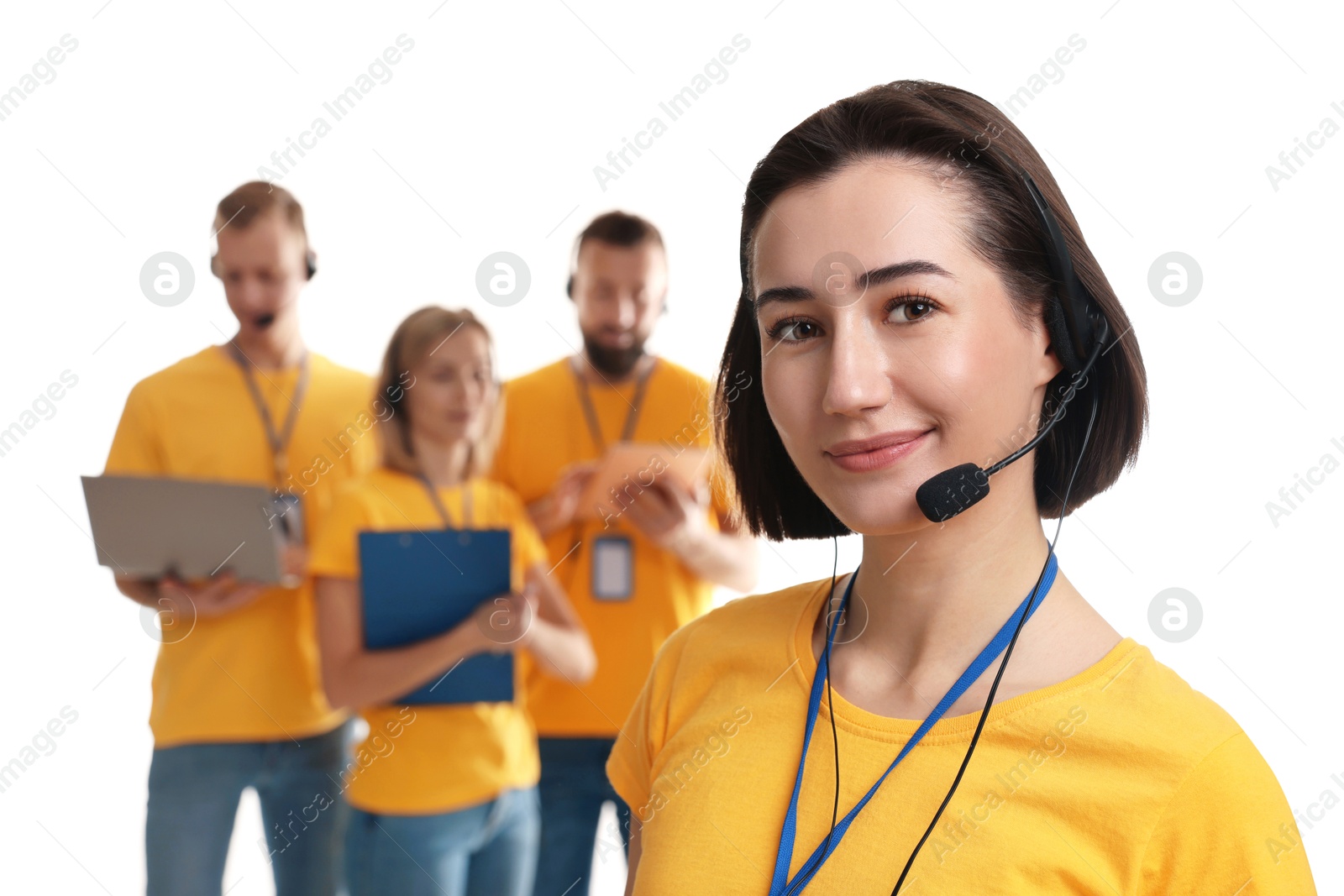 Photo of Technical support call center. Team of friendly operators on white background