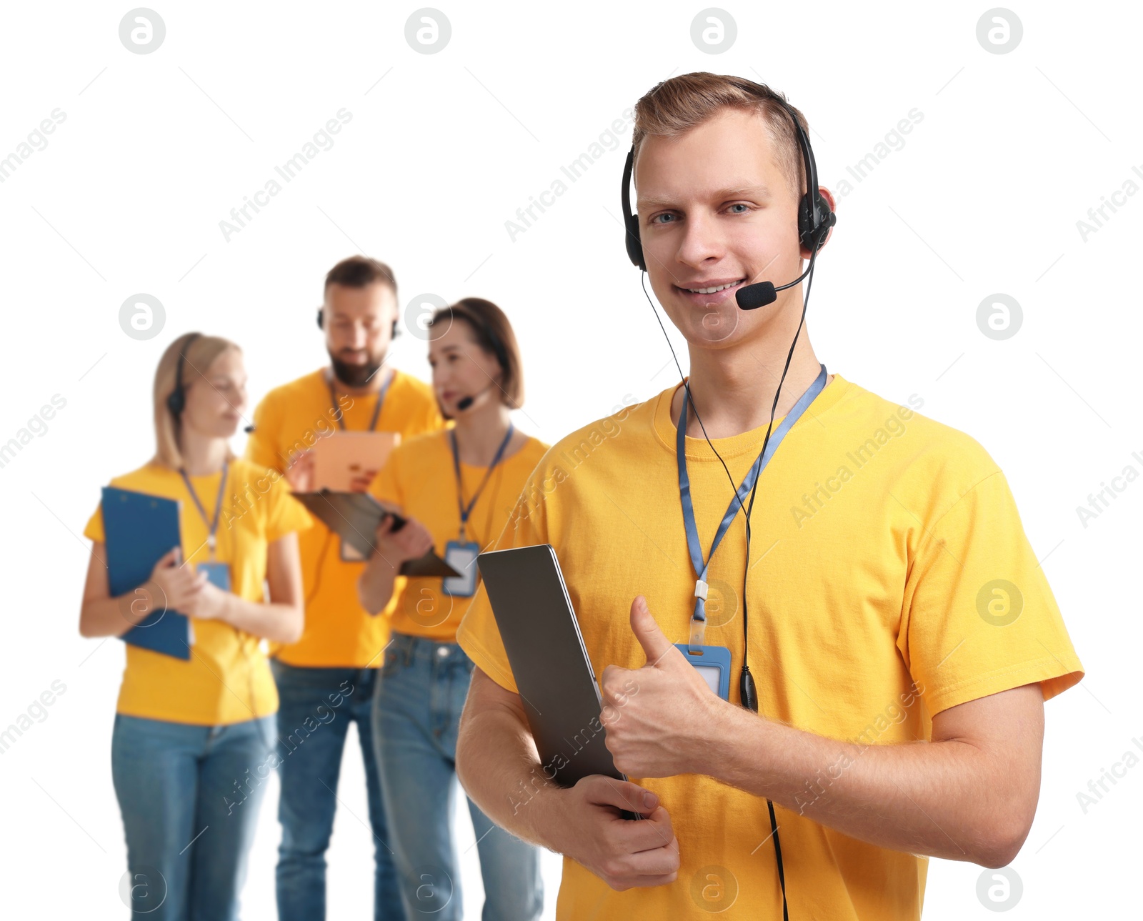 Photo of Technical support call center. Team of friendly operators on white background