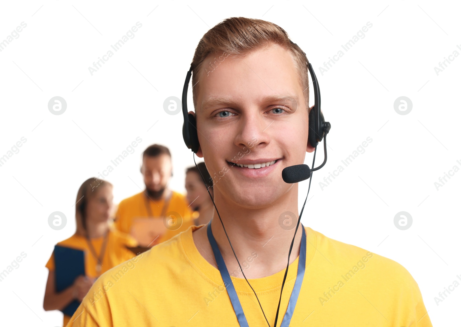 Photo of Technical support call center. Smiling operator on white background, selective focus