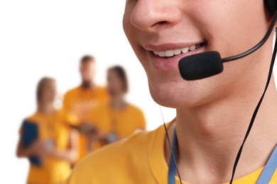 Technical support call center. Smiling operator on white background, closeup