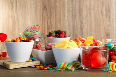 Photo of Candy bar. Many different sweets on wooden table