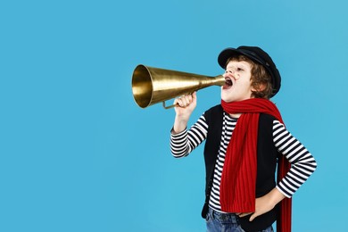 Photo of Cute boy in mime costume shouting in megaphone on light blue background, space for text. Surprise party