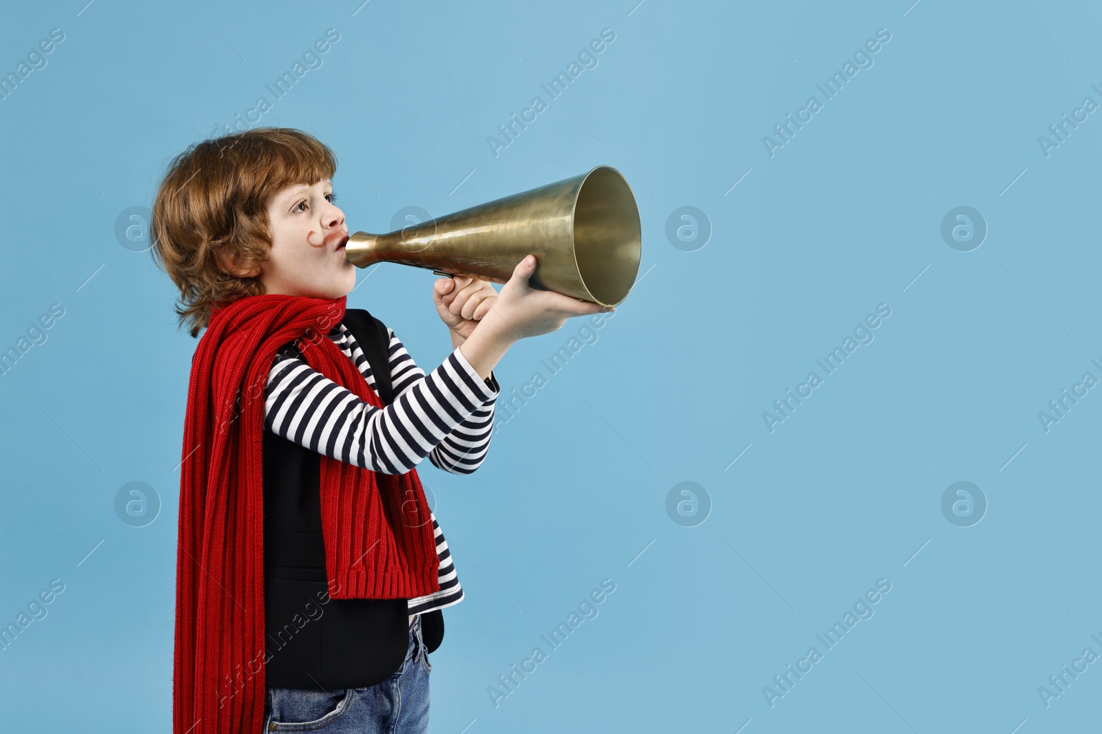 Photo of Cute boy in mime costume shouting in megaphone on light blue background, space for text. Surprise party