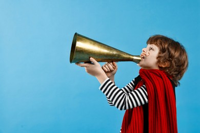 Photo of Cute boy in mime costume shouting in megaphone on light blue background, space for text. Surprise party