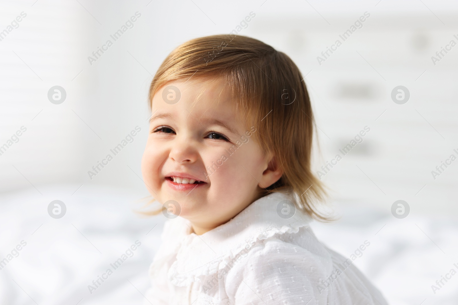 Photo of Portrait of cute little baby girl at home