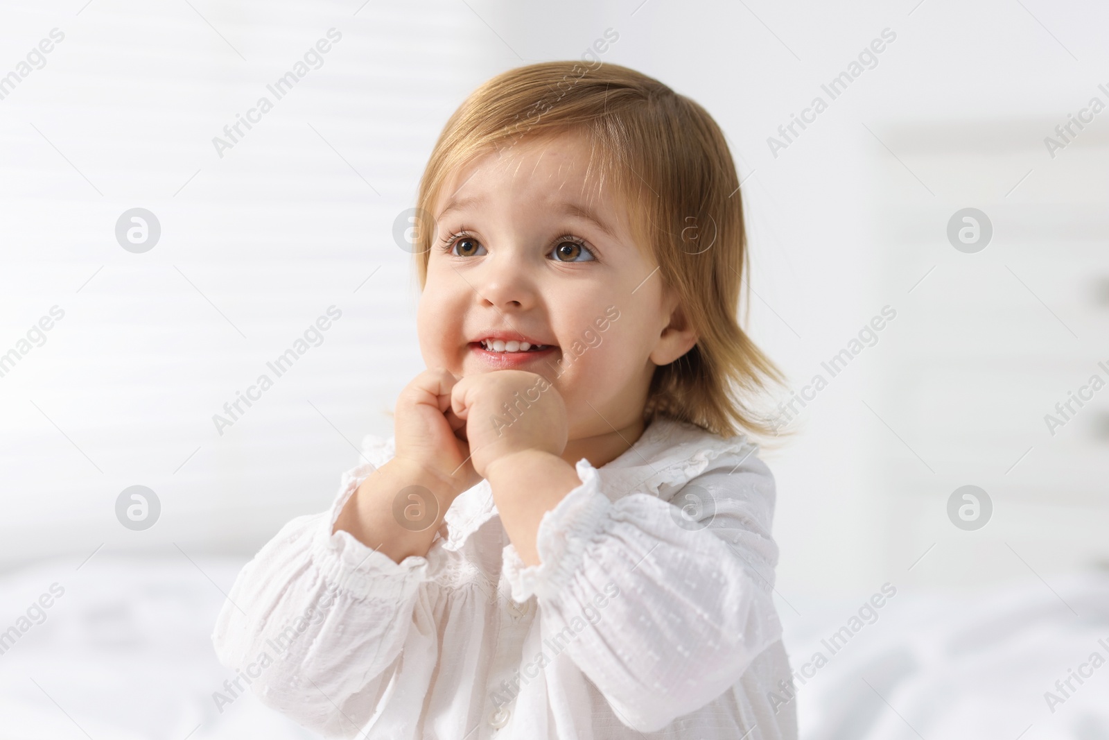 Photo of Portrait of cute little baby girl at home