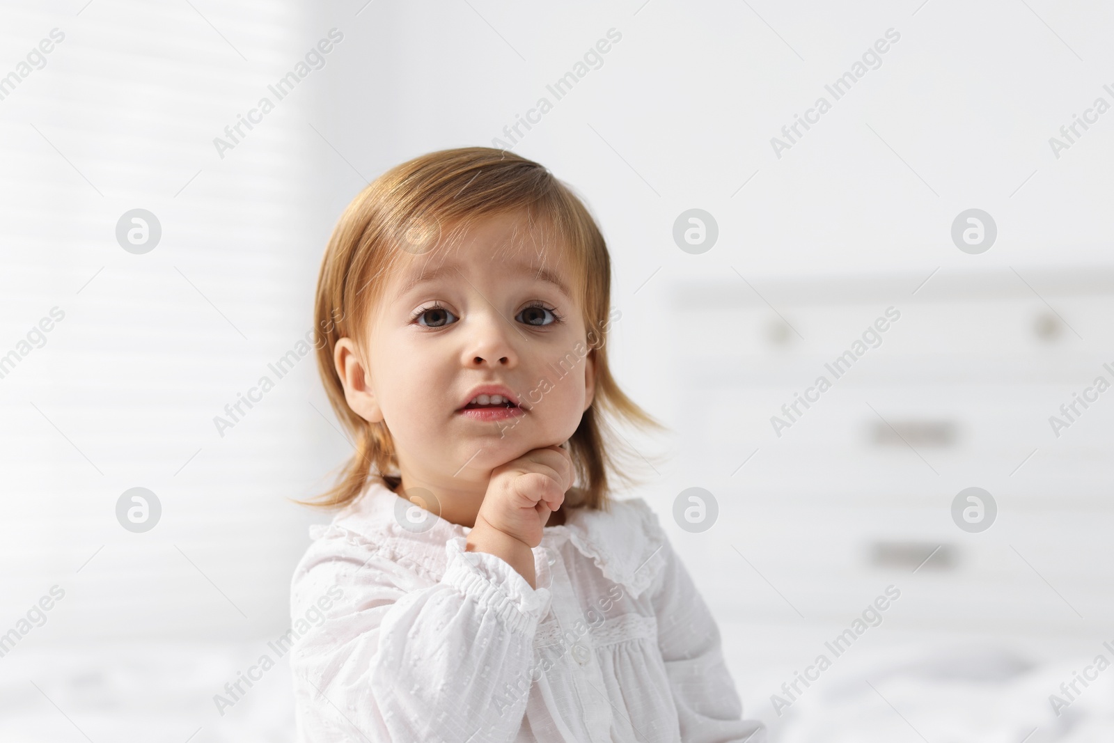 Photo of Portrait of cute little baby girl at home