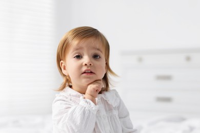 Photo of Portrait of cute little baby girl at home