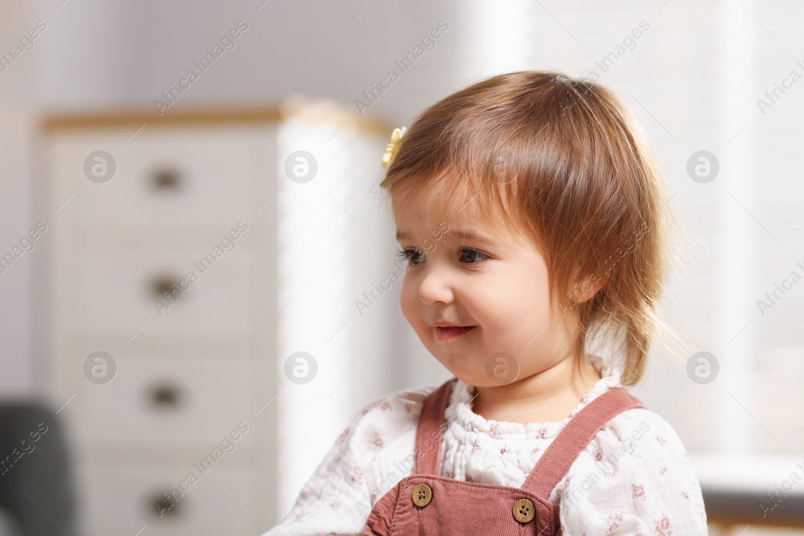 Photo of Portrait of cute little baby at home, space for text