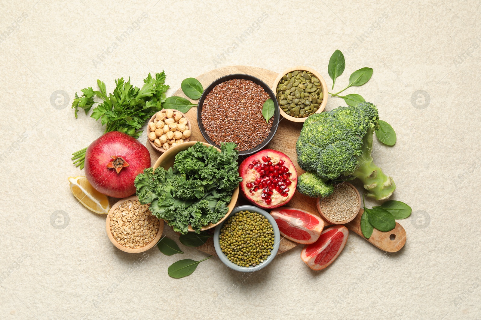 Photo of Different superfood products on light table, top view