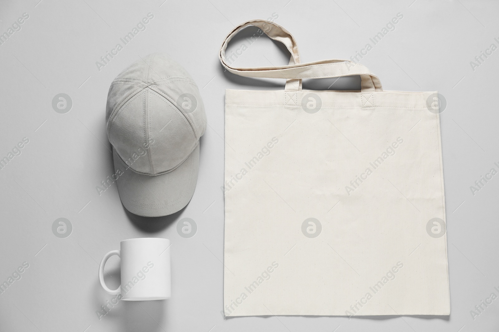 Photo of Different blank items for branding on gray background, flat lay. Mockup for design