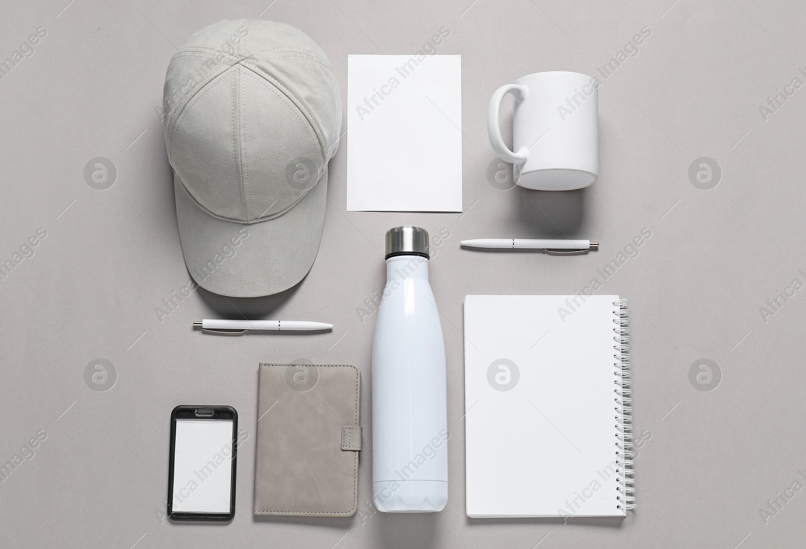 Photo of Different blank items for branding on grey background, flat lay. Mockup for design