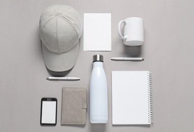 Photo of Different blank items for branding on grey background, flat lay. Mockup for design