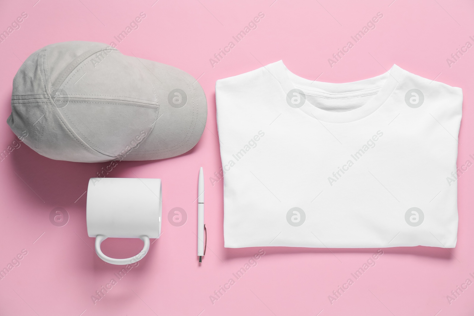 Photo of Different blank items for branding on pink background, flat lay. Mockup for design