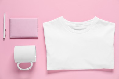 Photo of Different blank items for branding on pink background, flat lay. Mockup for design