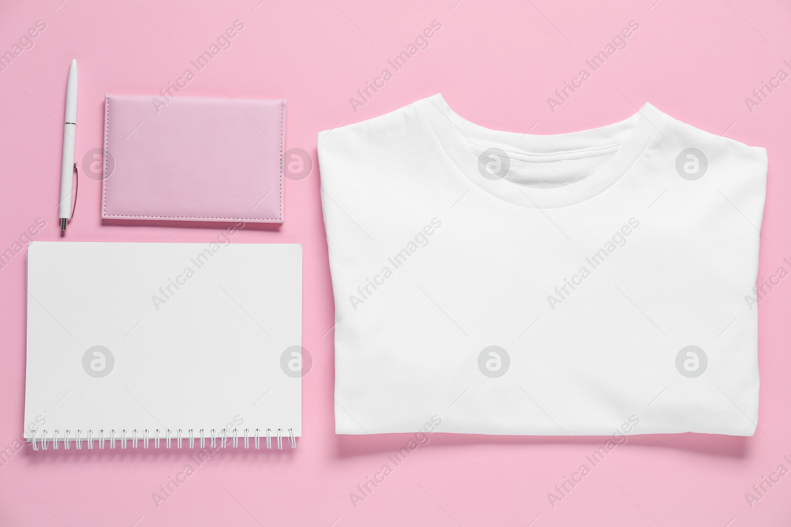 Photo of Different blank items for branding on pink background, flat lay. Mockup for design