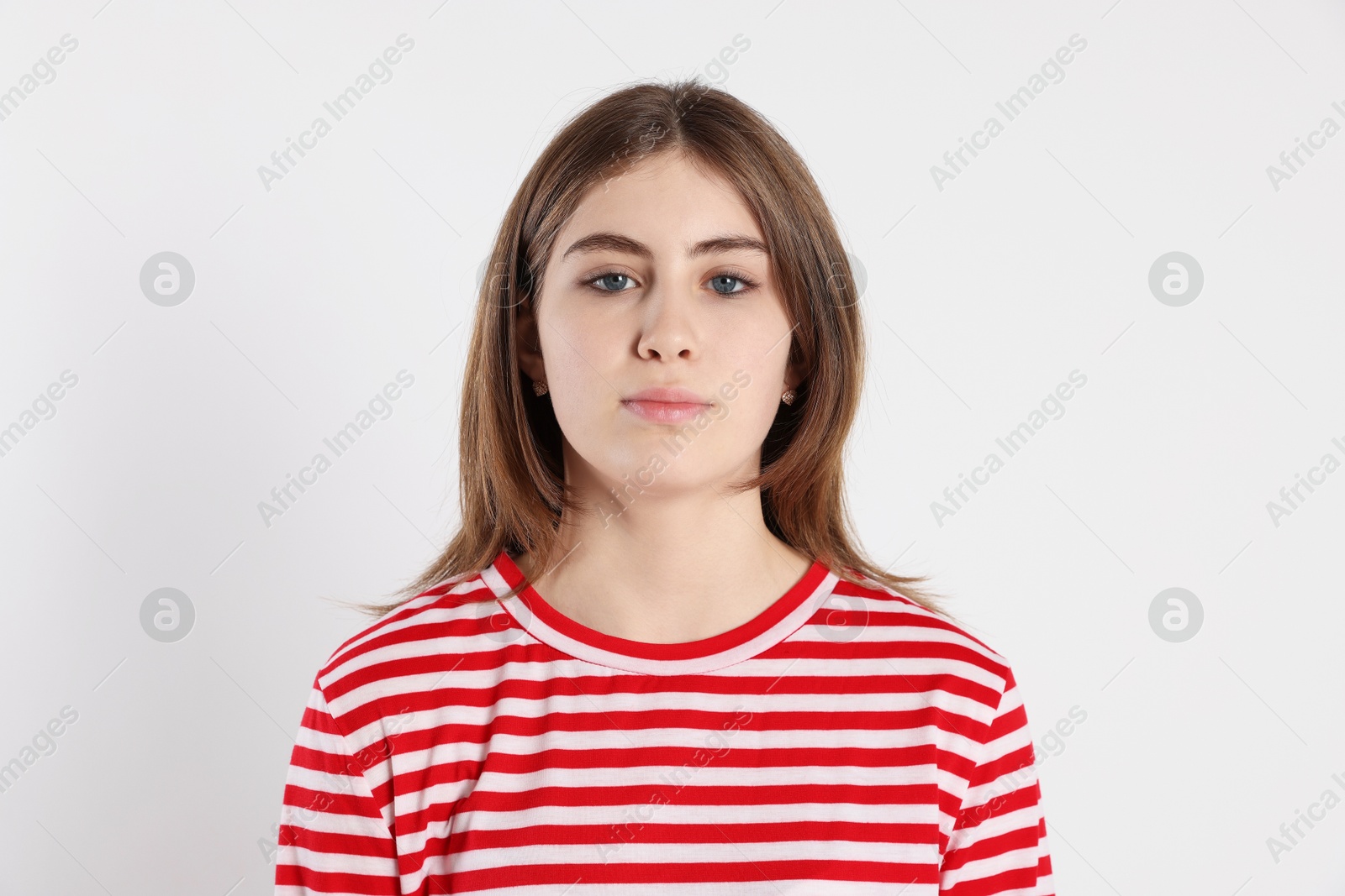 Photo of Portrait of beautiful teenage girl on light background