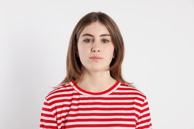 Photo of Portrait of beautiful teenage girl on light background