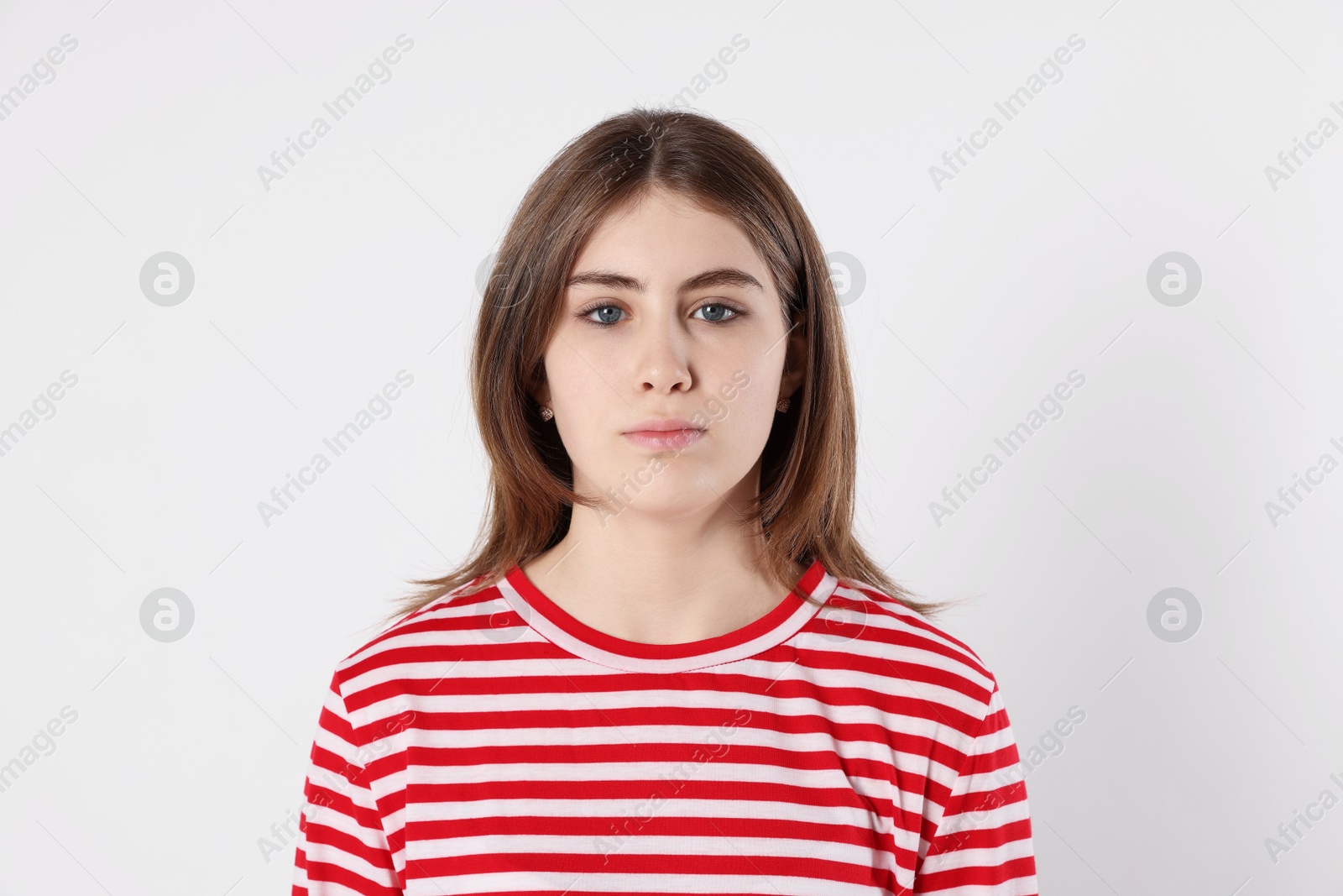 Photo of Portrait of beautiful teenage girl on light background