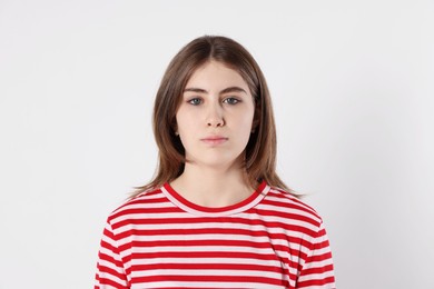 Photo of Portrait of beautiful teenage girl on light background