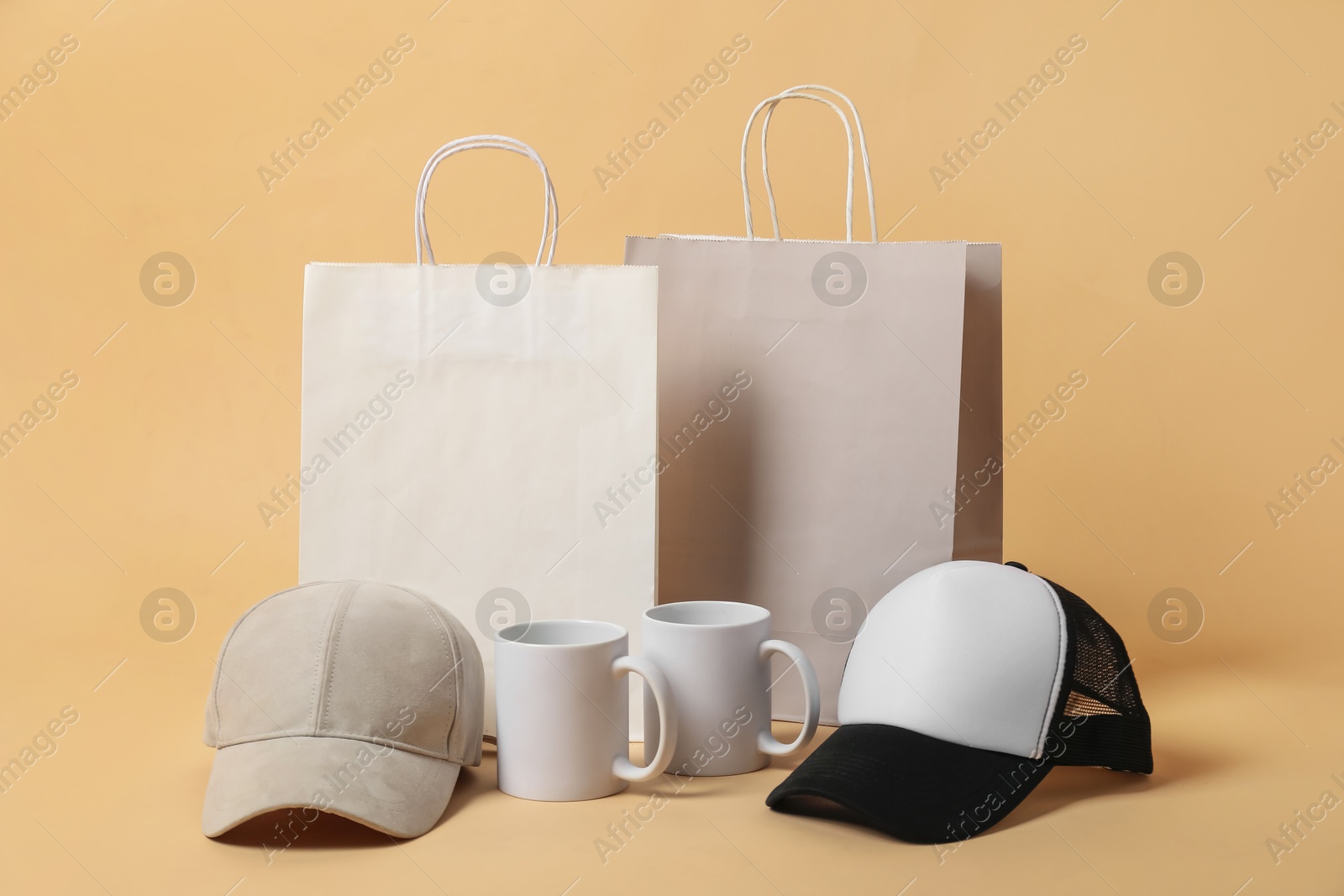 Photo of Different blank items for branding on beige background. Mockup for design