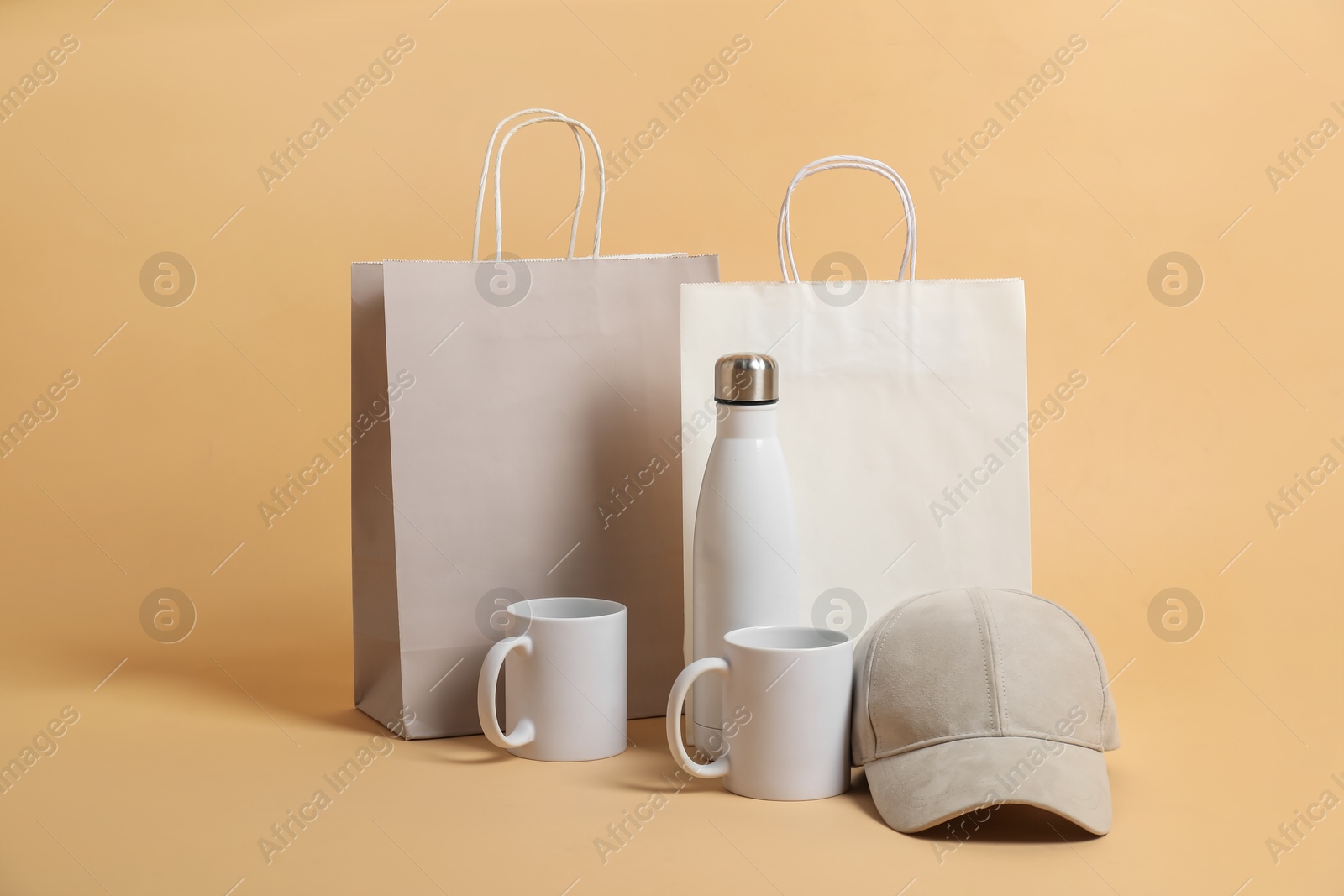 Photo of Different blank items for branding on beige background. Mockup for design