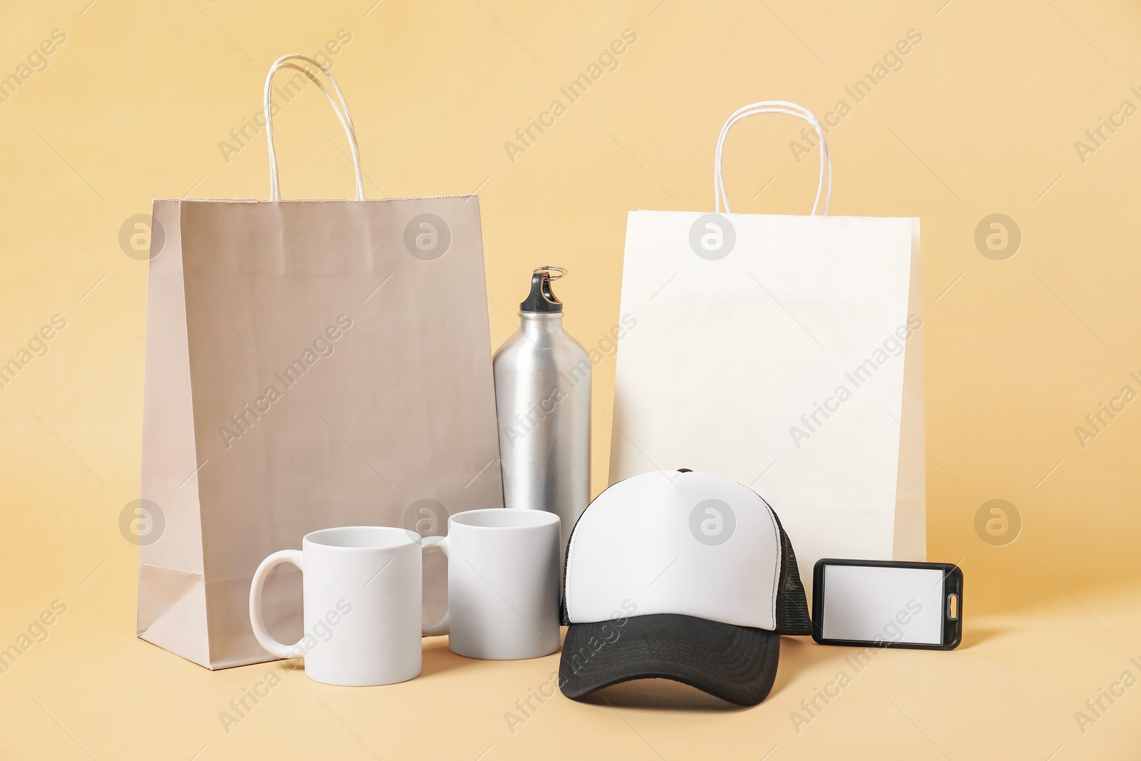 Photo of Different blank items for branding on beige background. Mockup for design