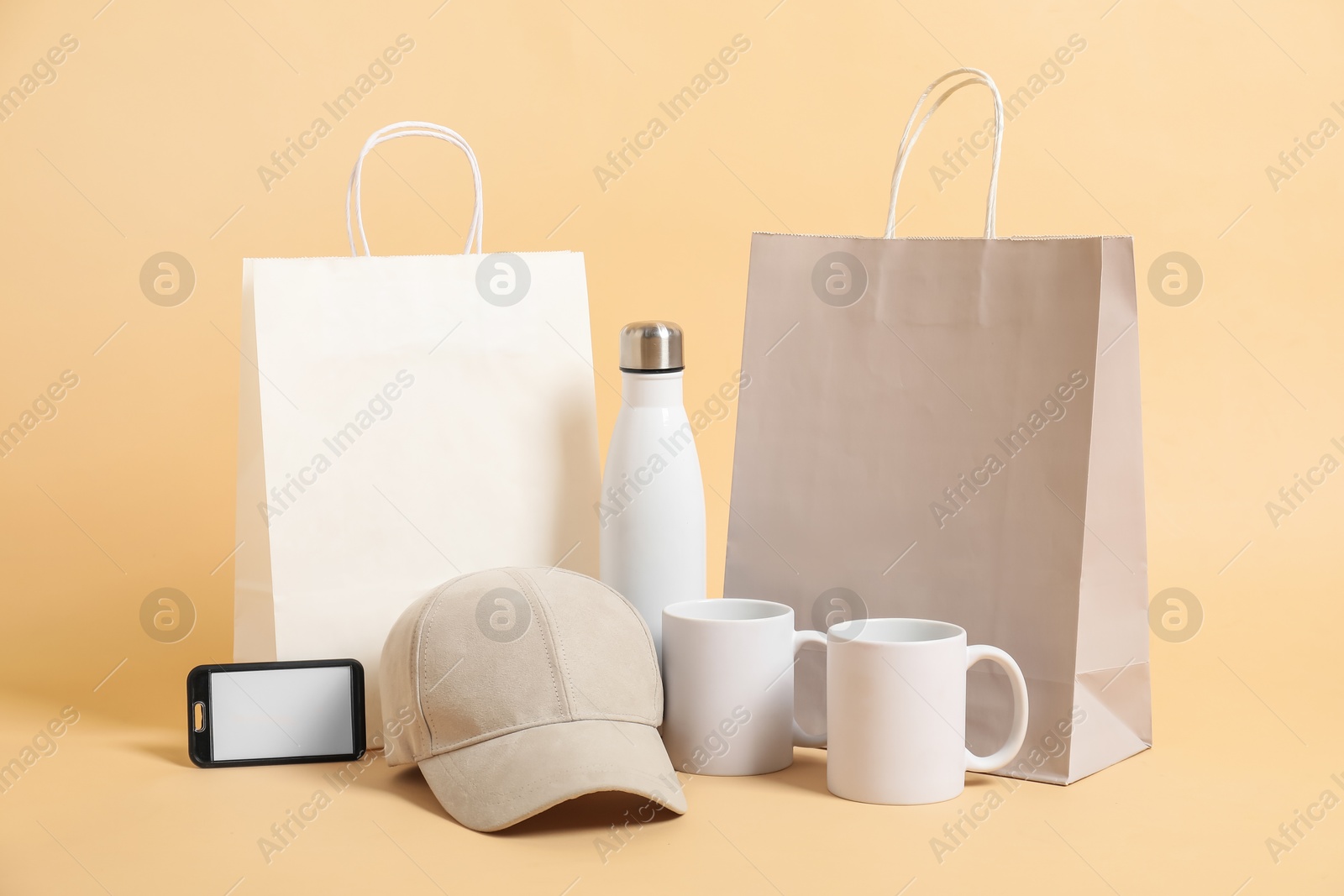 Photo of Different blank items for branding on beige background. Mockup for design