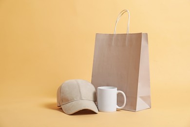 Photo of Different blank items for branding on beige background. Mockup for design