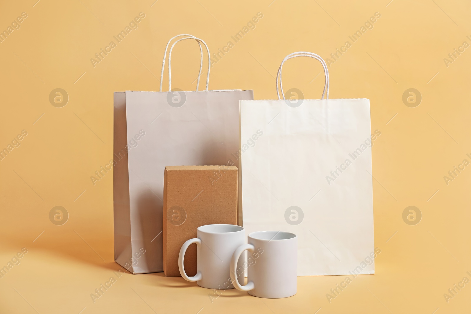 Photo of Different blank items for branding on beige background. Mockup for design