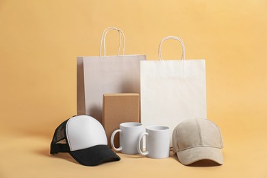 Photo of Different blank items for branding on beige background. Mockup for design