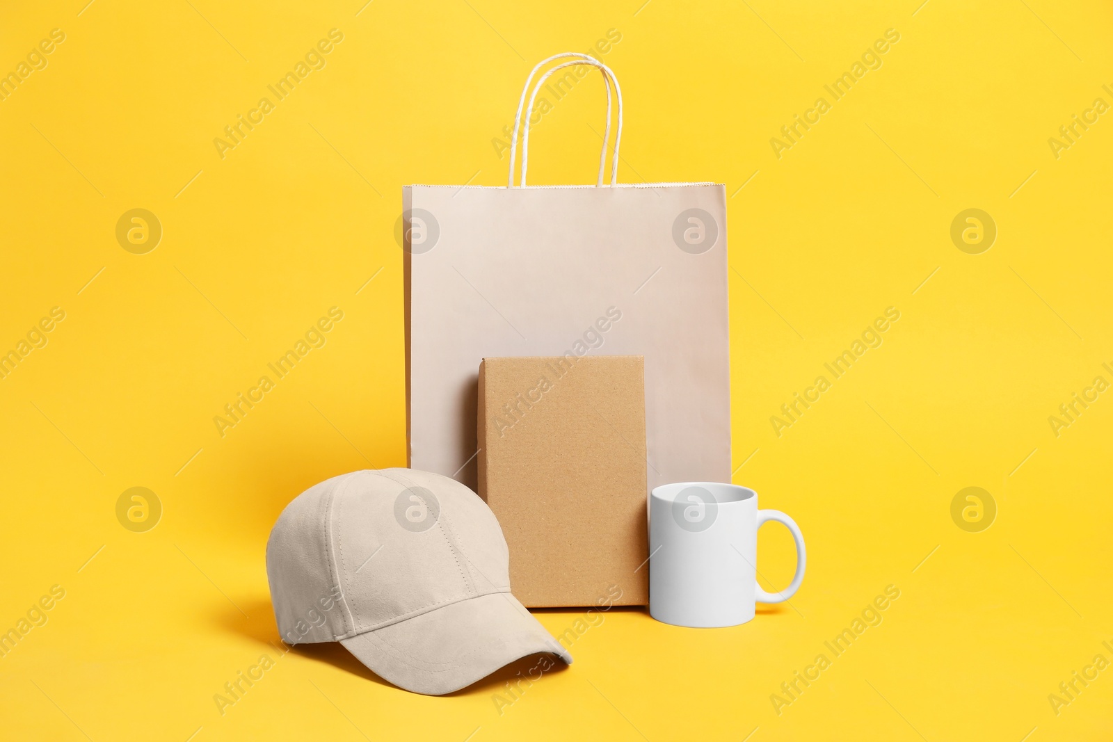 Photo of Different blank items for branding on orange background. Mockup for design