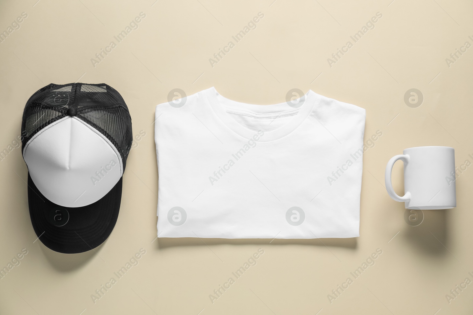 Photo of Different blank items for branding on beige background, flat lay. Mockup for design