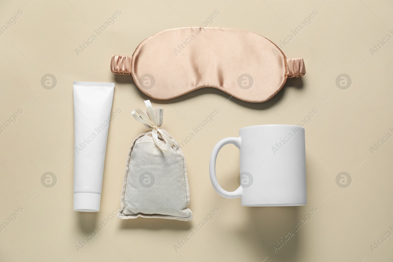 Photo of Different blank items for branding on beige background, flat lay. Mockup for design