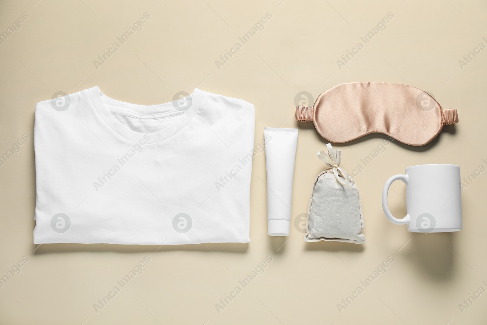 Photo of Different blank items for branding on beige background, flat lay. Mockup for design