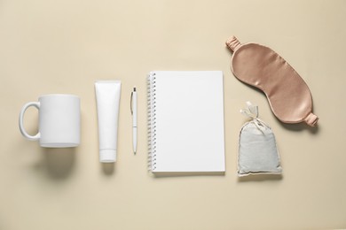 Photo of Different blank items for branding on beige background, flat lay. Mockup for design