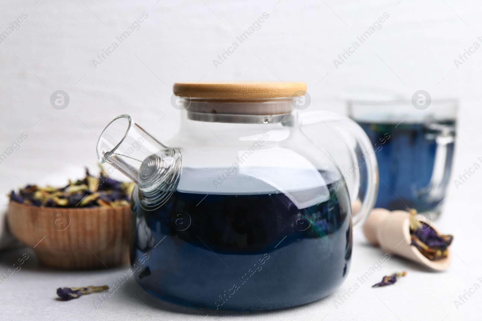 Photo of Delicious butterfly pea flower tea on white table