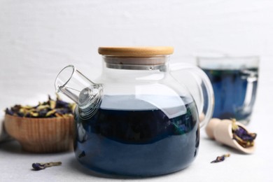 Delicious butterfly pea flower tea on white table