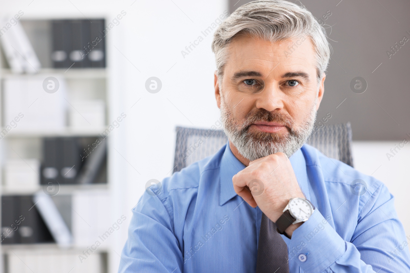 Photo of Portrait of banker at workplace, space for text