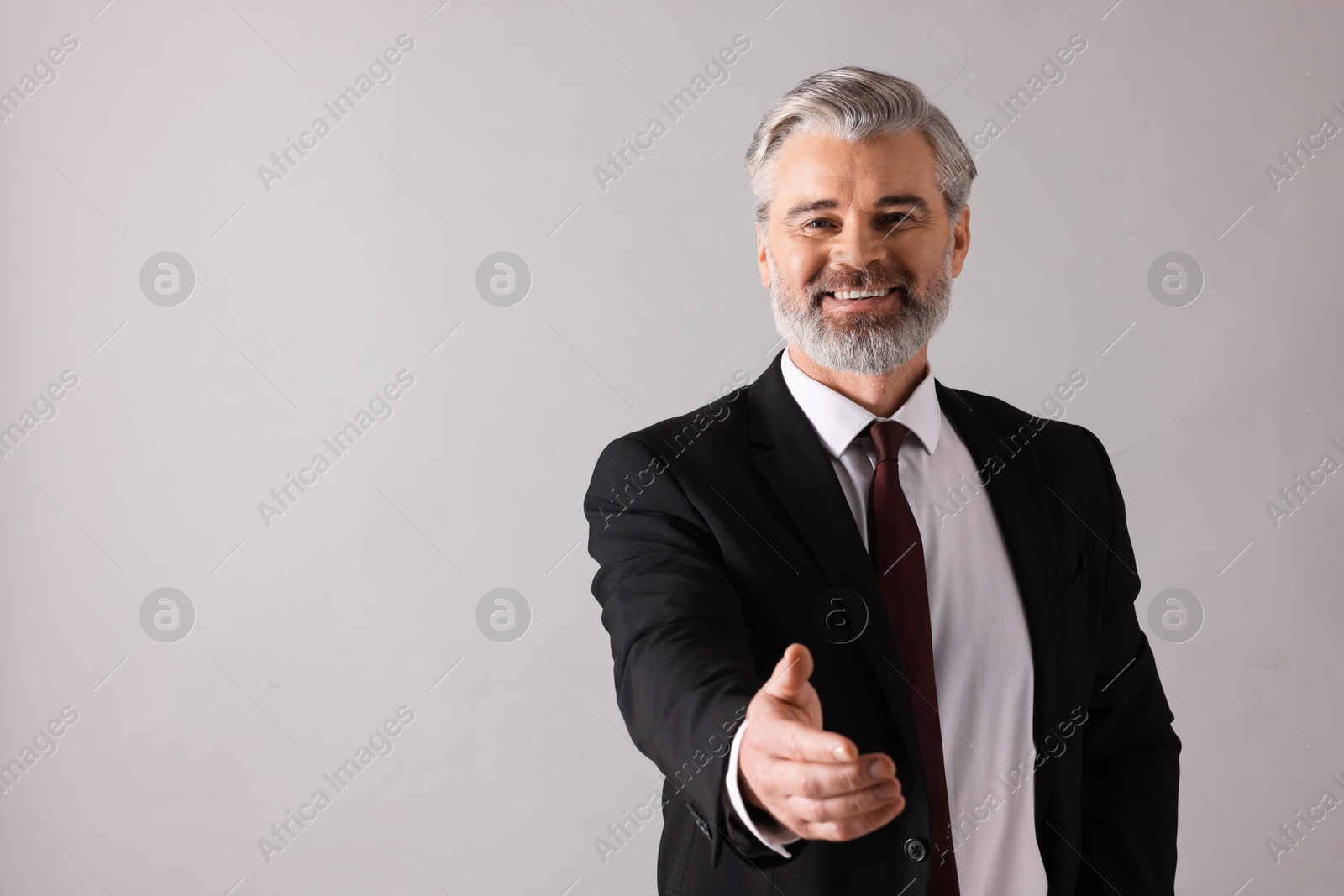 Photo of Portrait of banker on grey background, space for text