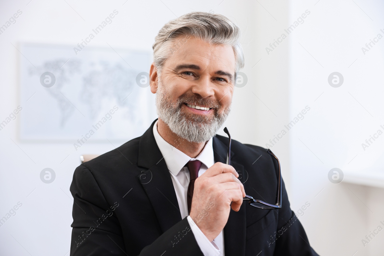 Photo of Portrait of banker with glasses in office