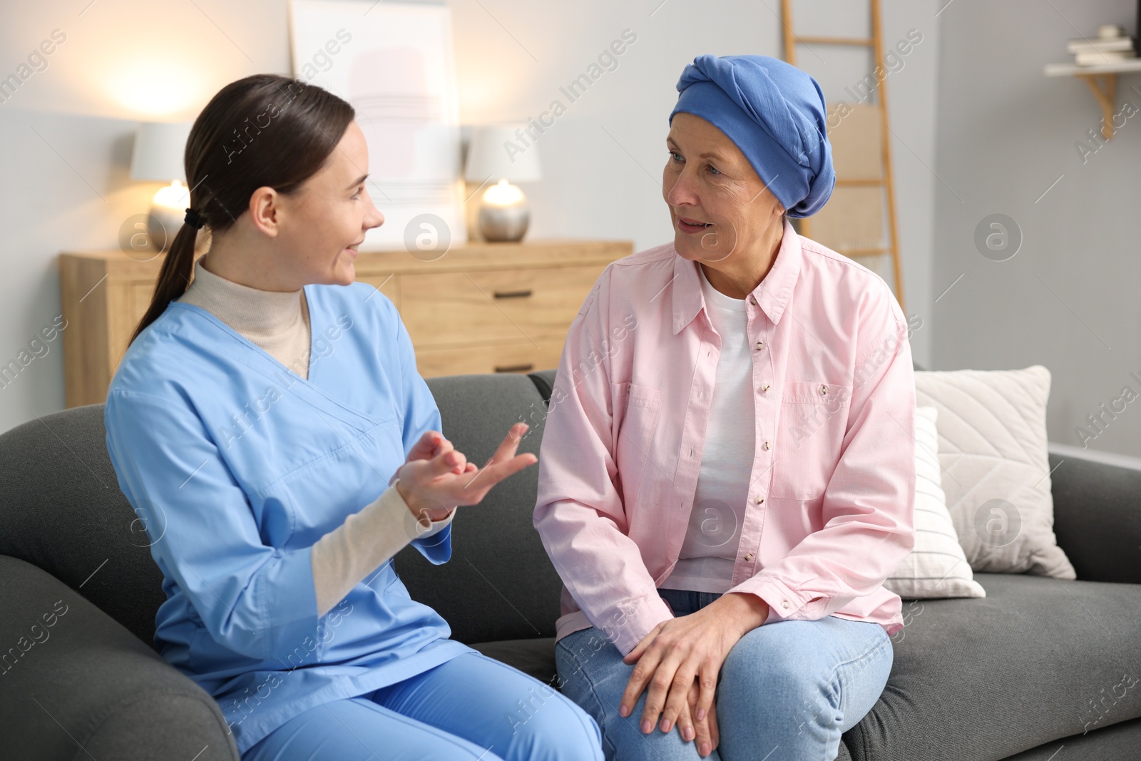 Photo of Woman with cancer and nurse at home