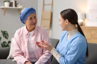 Photo of Woman with cancer and nurse at home