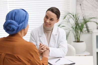 Photo of Senior woman with cancer visiting oncologist in clinic