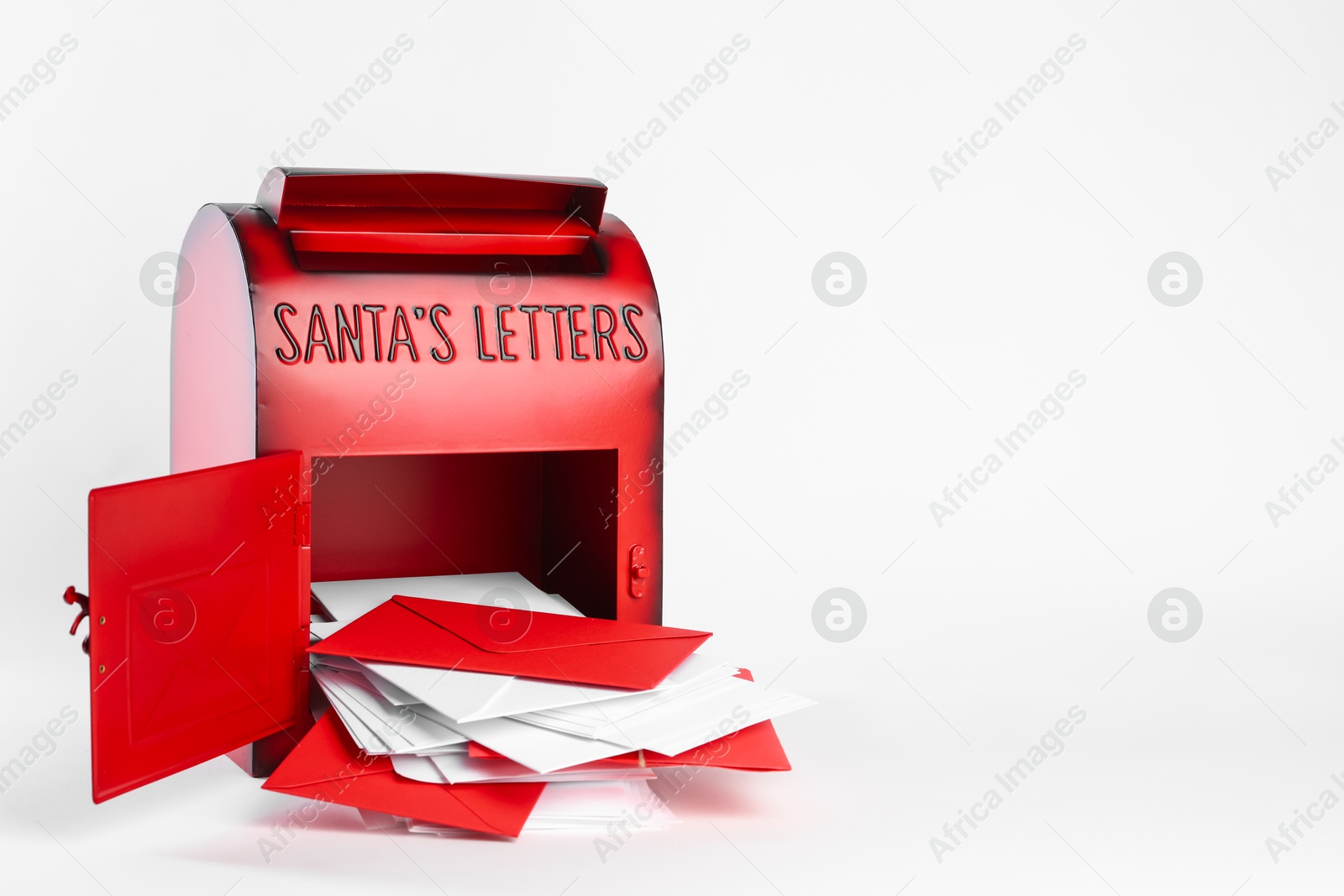 Photo of Santa Claus mail box with letters on white background, space for text. Christmas tradition