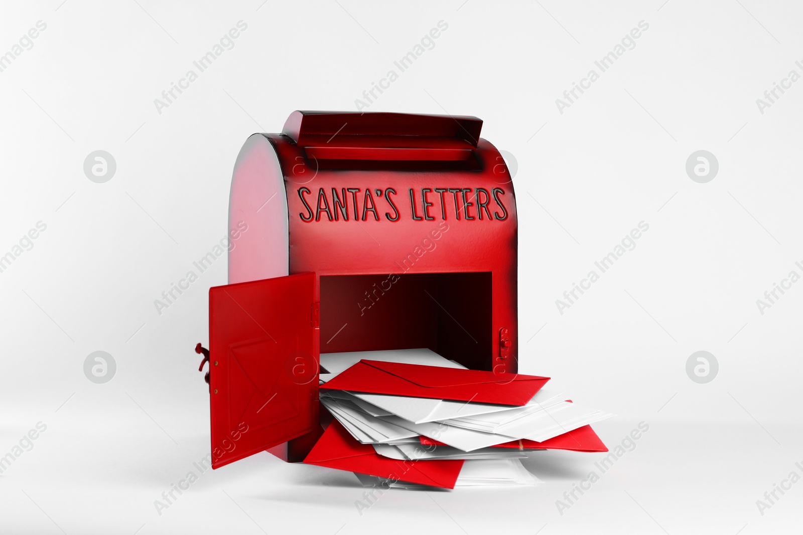 Photo of Santa Claus mail box with letters on white background. Christmas tradition