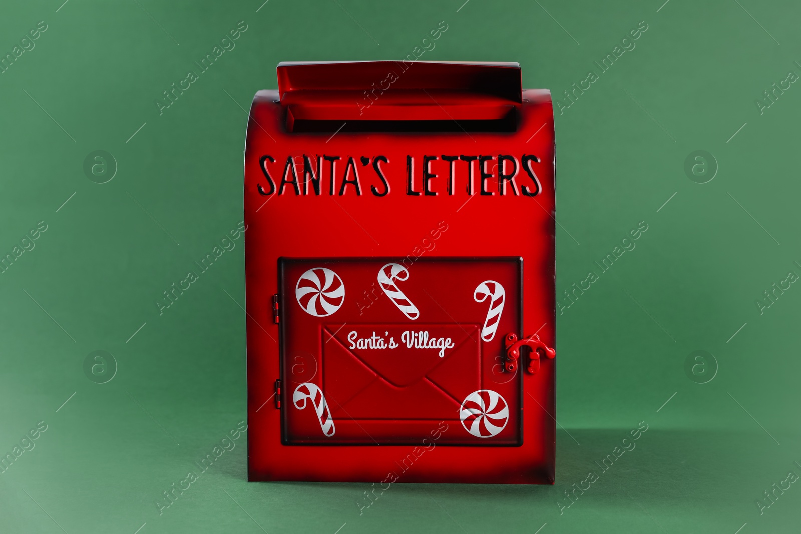 Photo of Santa Claus mail box on dark green background. Christmas tradition