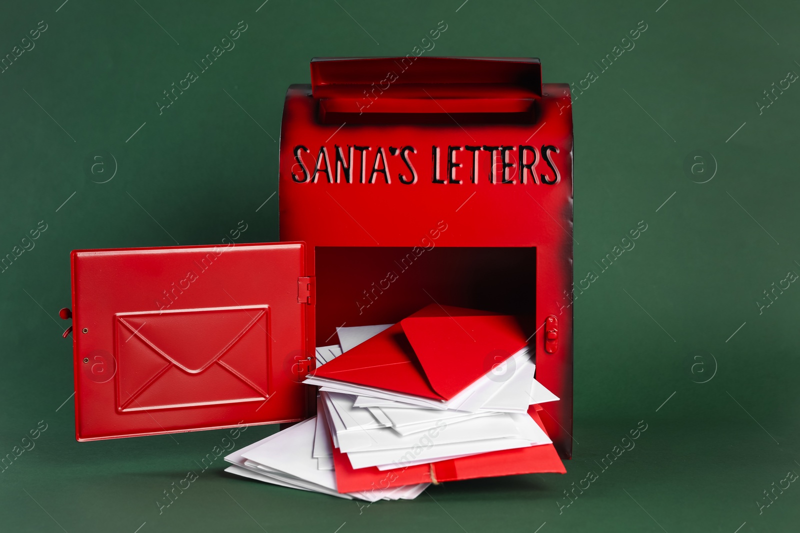 Photo of Santa Claus mail box with letters on dark green background. Christmas tradition