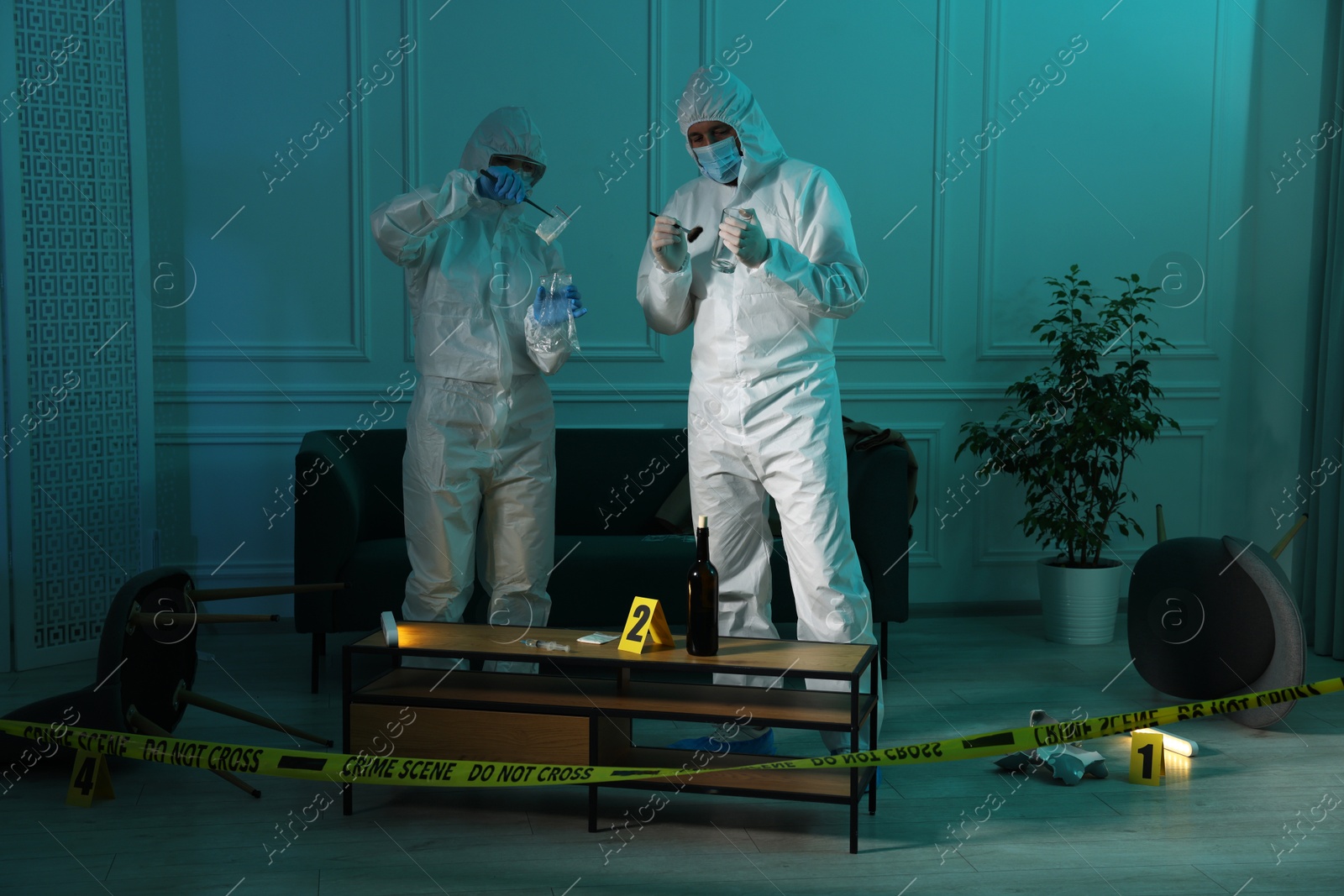 Photo of Forensic experts working at crime scene indoors