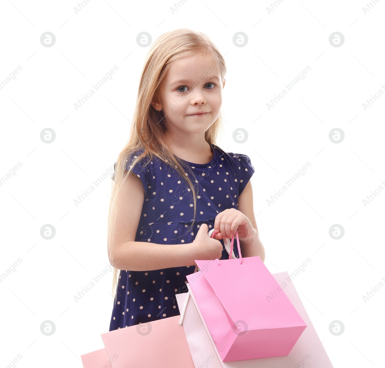 Photo of Little girl with shopping bags on white background